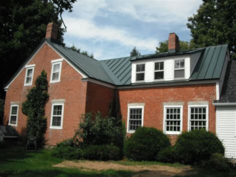 black metal roof on red brick house|metal roof on brick ranch.